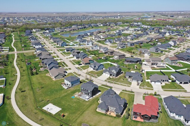 aerial overview of property's location featuring nearby suburban area and a large body of water