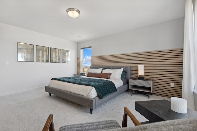 carpeted bedroom with baseboards