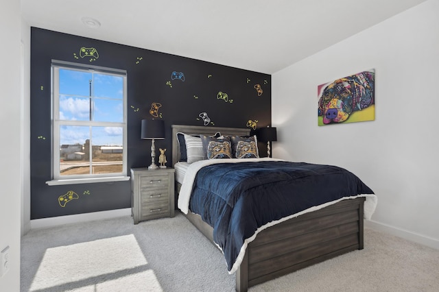 bedroom featuring carpet and baseboards