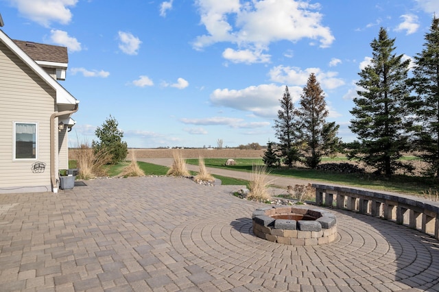 view of patio featuring an outdoor fire pit