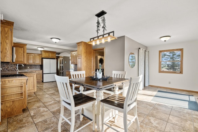 dining room featuring baseboards