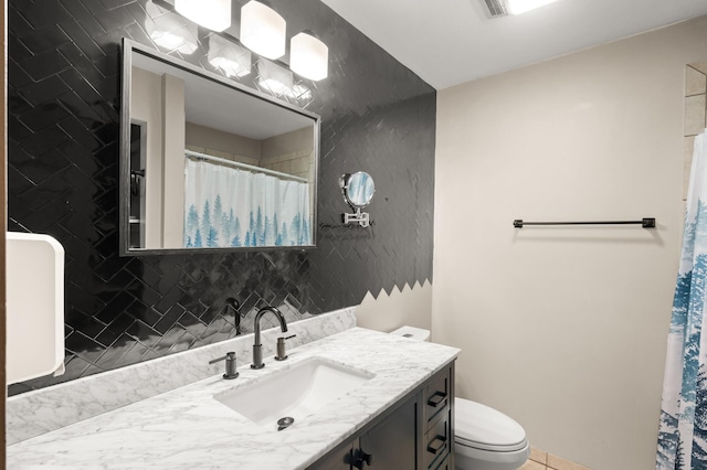 full bath with vanity, toilet, tile patterned floors, a shower with curtain, and visible vents