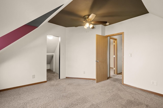 bonus room with baseboards, a ceiling fan, lofted ceiling, and carpet flooring