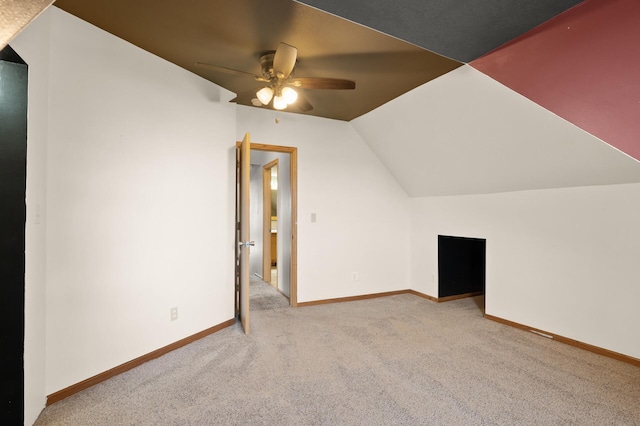 bonus room featuring baseboards, a ceiling fan, carpet flooring, and lofted ceiling