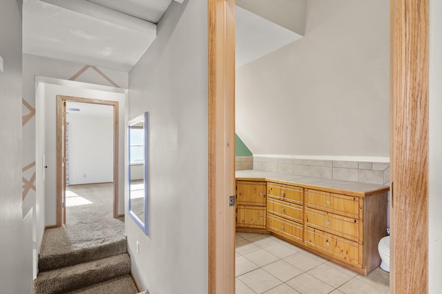 bathroom with toilet and tile patterned floors