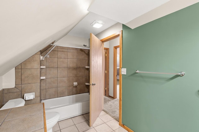 full bathroom with tile patterned floors, lofted ceiling, toilet, and tub / shower combination