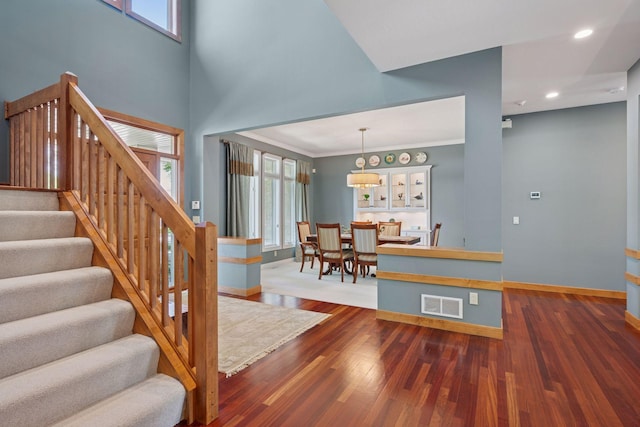 4970 Yuma Ct N, Plymouth, MN 55446 - stairway featuring baseboards, wood finished floors, crown molding, and recessed lighting