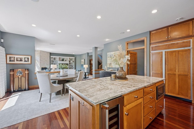 4970 Yuma Ct N, Plymouth, MN 55446 - kitchen with wine cooler, built in appliances, a center island, dark wood-style flooring, and recessed lighting