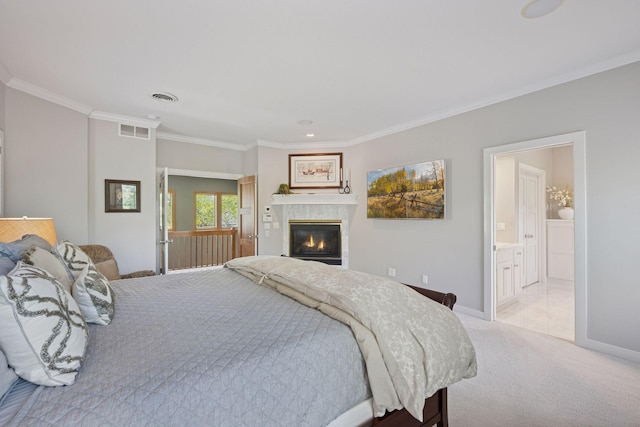4970 Yuma Ct N, Plymouth, MN 55446 - bedroom featuring crown molding, a glass covered fireplace, light colored carpet, baseboards, and ensuite bathroom