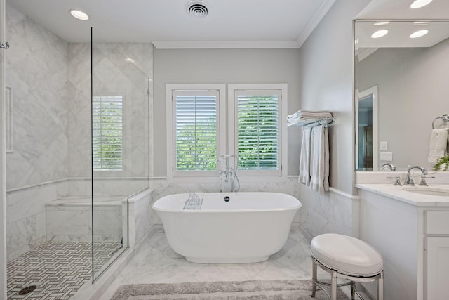 4970 Yuma Ct N, Plymouth, MN 55446 - bathroom featuring a freestanding bath, crown molding, a stall shower, marble finish flooring, and tile walls