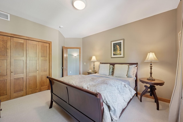 4970 Yuma Ct N, Plymouth, MN 55446 - bedroom with light colored carpet, a closet, and baseboards