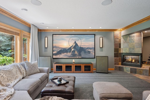 4970 Yuma Ct N, Plymouth, MN 55446 - carpeted home theater room with ornamental molding, a tile fireplace, baseboards, recessed lighting, and a textured ceiling