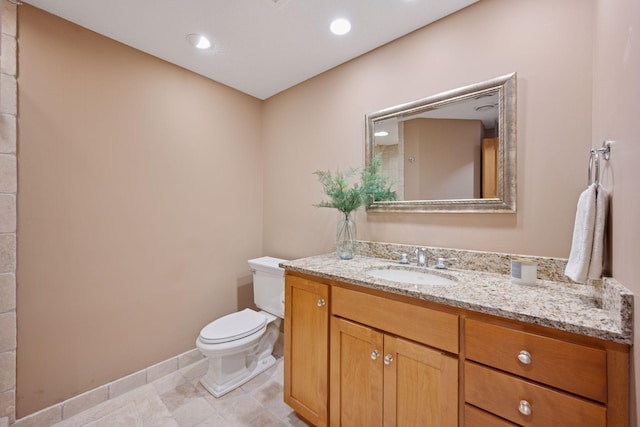 4970 Yuma Ct N, Plymouth, MN 55446 - bathroom with toilet, vanity, baseboards, and tile patterned flooring