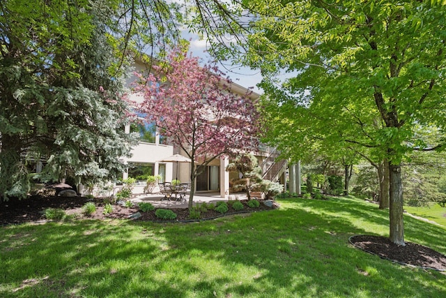 4970 Yuma Ct N, Plymouth, MN 55446 - view of grassy yard with a patio