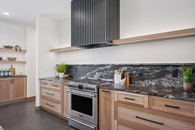 kitchen with light brown cabinets, open shelves, dark stone countertops, stainless steel range with gas stovetop, and backsplash