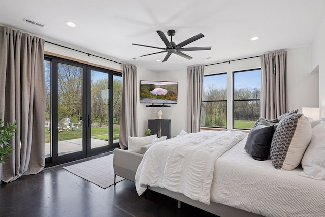 bedroom with multiple windows, french doors, access to exterior, and recessed lighting