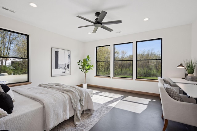 bedroom with baseboards, recessed lighting, visible vents, and concrete floors