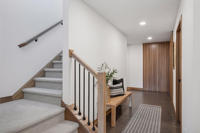 stairs featuring baseboards and recessed lighting
