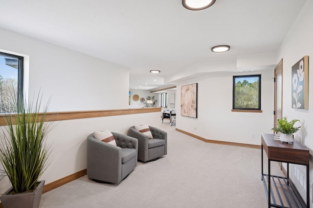 living area with light carpet, baseboards, and recessed lighting