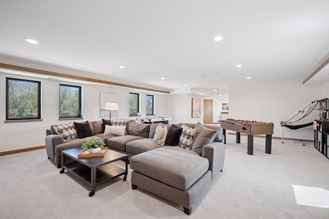living area with light carpet, baseboards, and recessed lighting