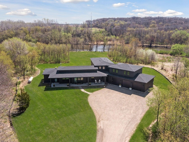 aerial view featuring a water view and a wooded view