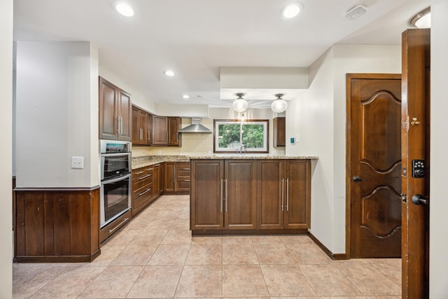 21 Red Fox Rd, North Oaks, MN 55127 - kitchen with wall chimney range hood, stainless steel double oven, recessed lighting, light tile patterned floors, and a sink