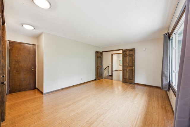 21 Red Fox Rd, North Oaks, MN 55127 - spare room featuring light wood finished floors and baseboards