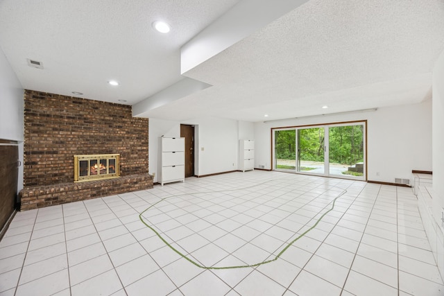 21 Red Fox Rd, North Oaks, MN 55127 - unfurnished living room featuring a textured ceiling, recessed lighting, a fireplace, and light tile patterned floors