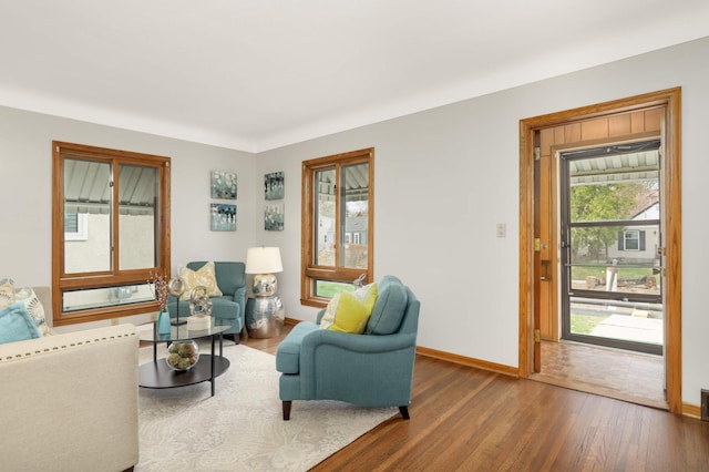 living room featuring baseboards and wood finished floors