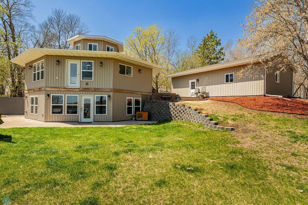 17175 200th St, Audubon, MN 56554 - back of property with a patio and a lawn