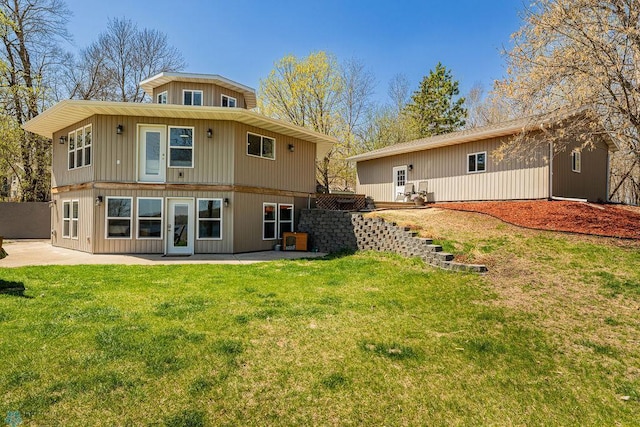 17175 200th St, Audubon, MN 56554 - back of property with a patio and a lawn