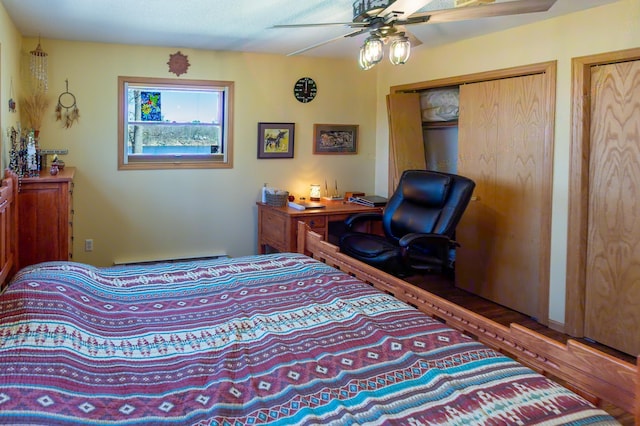 bedroom with multiple closets and a ceiling fan