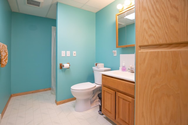 bathroom featuring visible vents, baseboards, toilet, and vanity