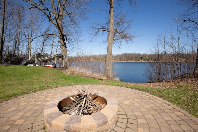 view of water feature with a fire pit
