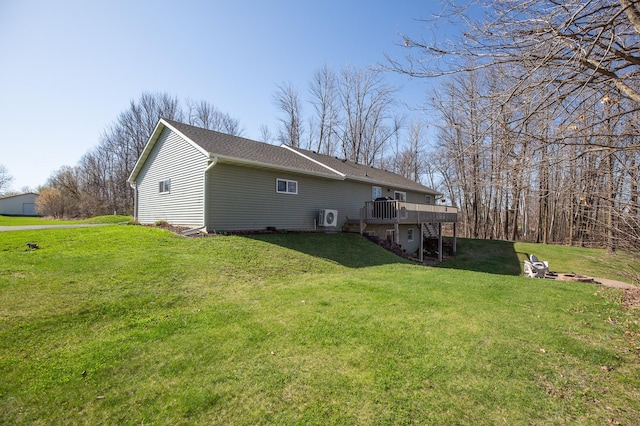 back of house with a lawn, ac unit, and a wooden deck