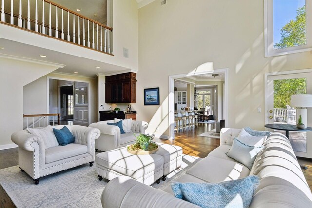 1510 Green Trees Rd, Orono, MN 55391 - living area with a high ceiling, wood finished floors, french doors, crown molding, and baseboards