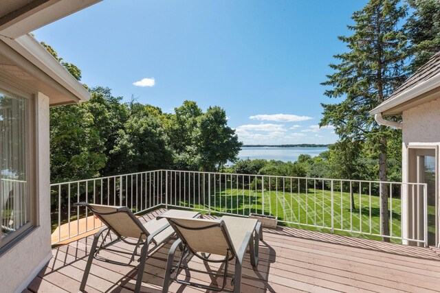 1510 Green Trees Rd, Orono, MN 55391 - wooden deck with a water view and a lawn