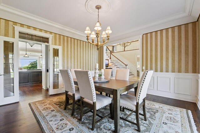 1510 Green Trees Rd, Orono, MN 55391 - dining area with wallpapered walls, a chandelier, crown molding, stairway, and dark wood-style flooring