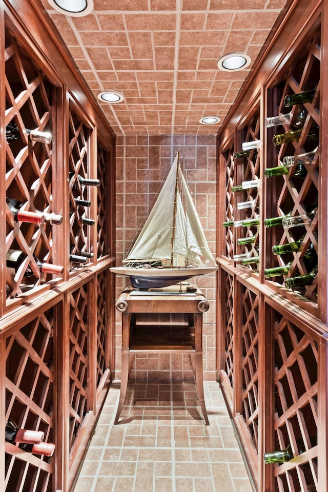 1510 Green Trees Rd, Orono, MN 55391 - wine cellar featuring recessed lighting and brick patterned floors