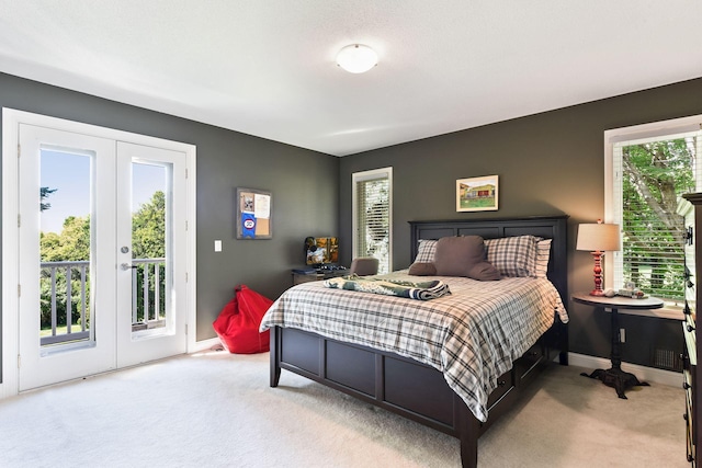 1510 Green Trees Rd, Orono, MN 55391 - carpeted bedroom with french doors, access to outside, multiple windows, and baseboards