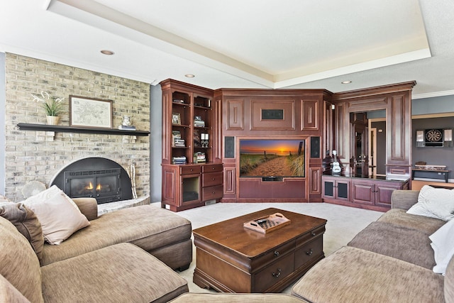1510 Green Trees Rd, Orono, MN 55391 - carpeted living area featuring a raised ceiling, a fireplace, crown molding, and recessed lighting