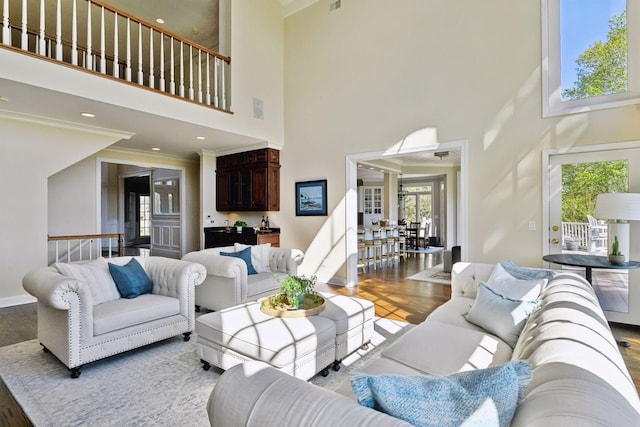 1510 Green Trees Rd, Orono, MN 55391 - living area featuring a towering ceiling, wood finished floors, french doors, and ornamental molding
