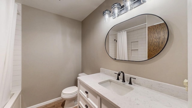 full bath with toilet and vanity