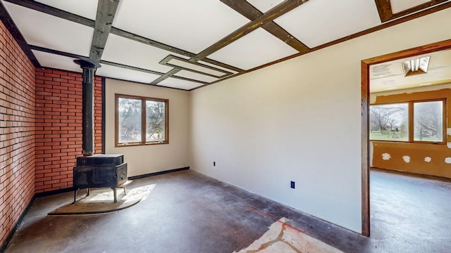 unfurnished sunroom featuring a wood stove
