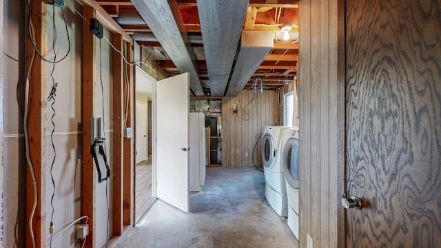 clothes washing area with washer and clothes dryer