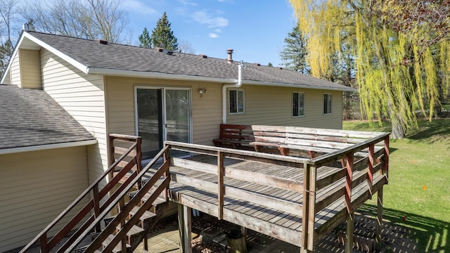 wooden deck with a lawn
