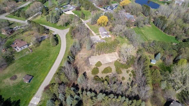 aerial view of property and surrounding area with a large body of water