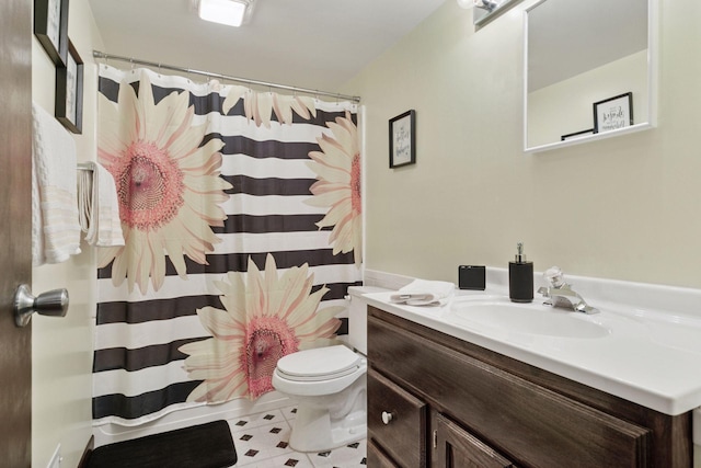 bathroom with toilet, vanity, and a shower with curtain