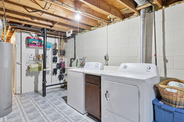 washroom featuring independent washer and dryer, water heater, and light flooring