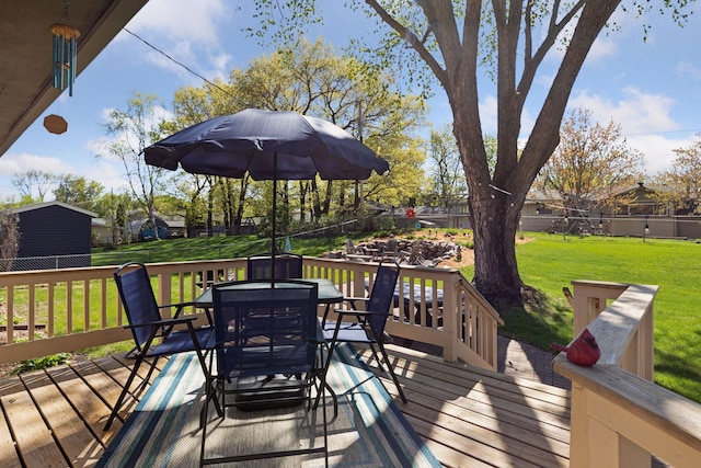 wooden terrace with outdoor dining area